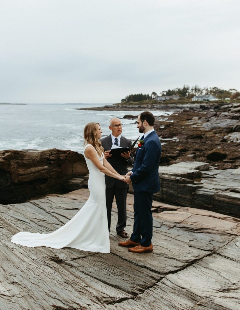 A couple exchanges vows at their Two Lights State Park elopement. 