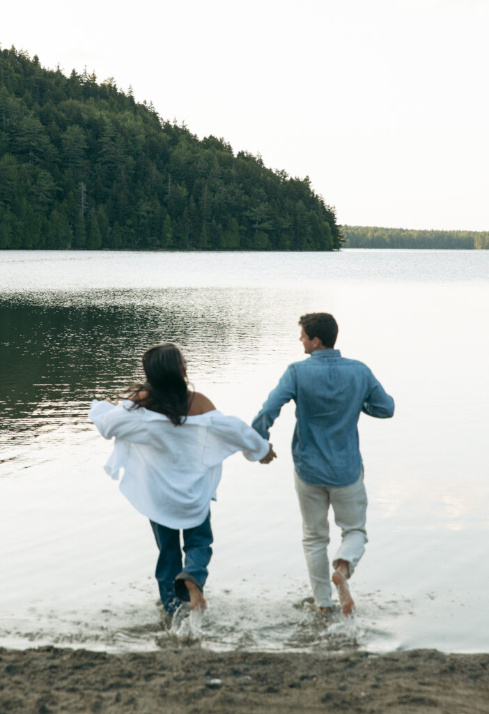 Couple takes photos at Acadia National Park the night before their wedding