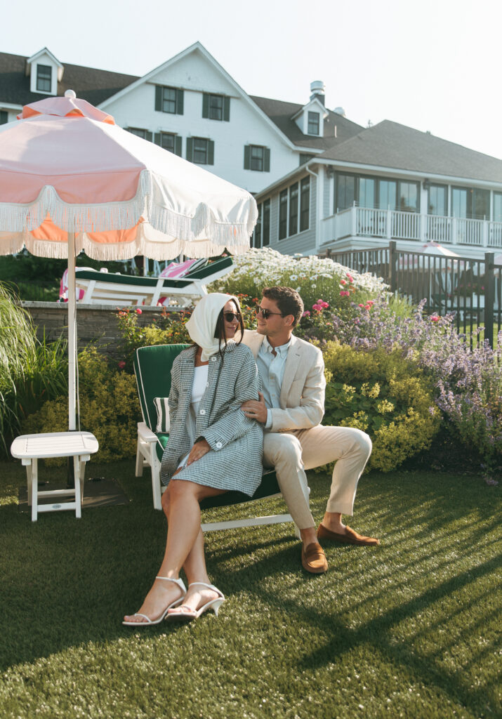 Couple sits poolside at The Claremont Hotel the night before their wedding