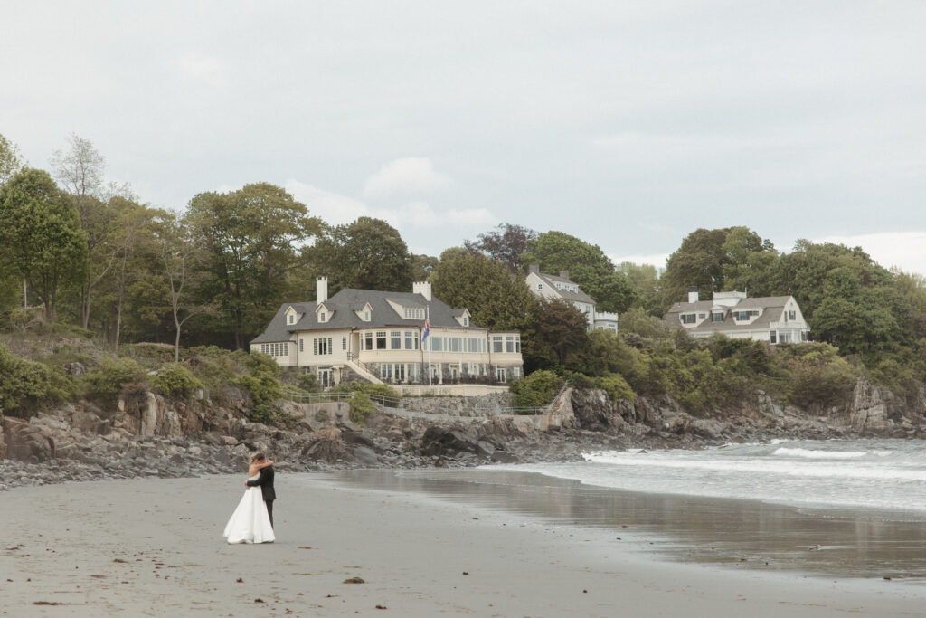 couple celebrate at sunset on the beach at this coastal maine wedding in York, Maine