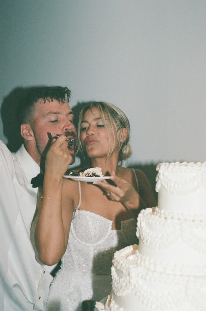 cake cutting film photography during a coastal Maine wedding at York Harbor Inn's ballroom
