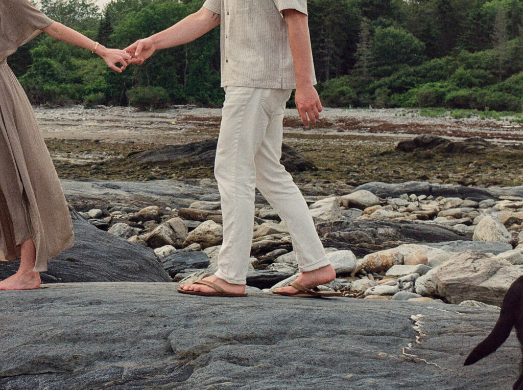 Artful candid moments on film captured during a Portland, Maine engagement session