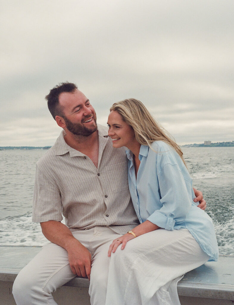 Maine engagement photos on a boat off the coast of Portland, Maine