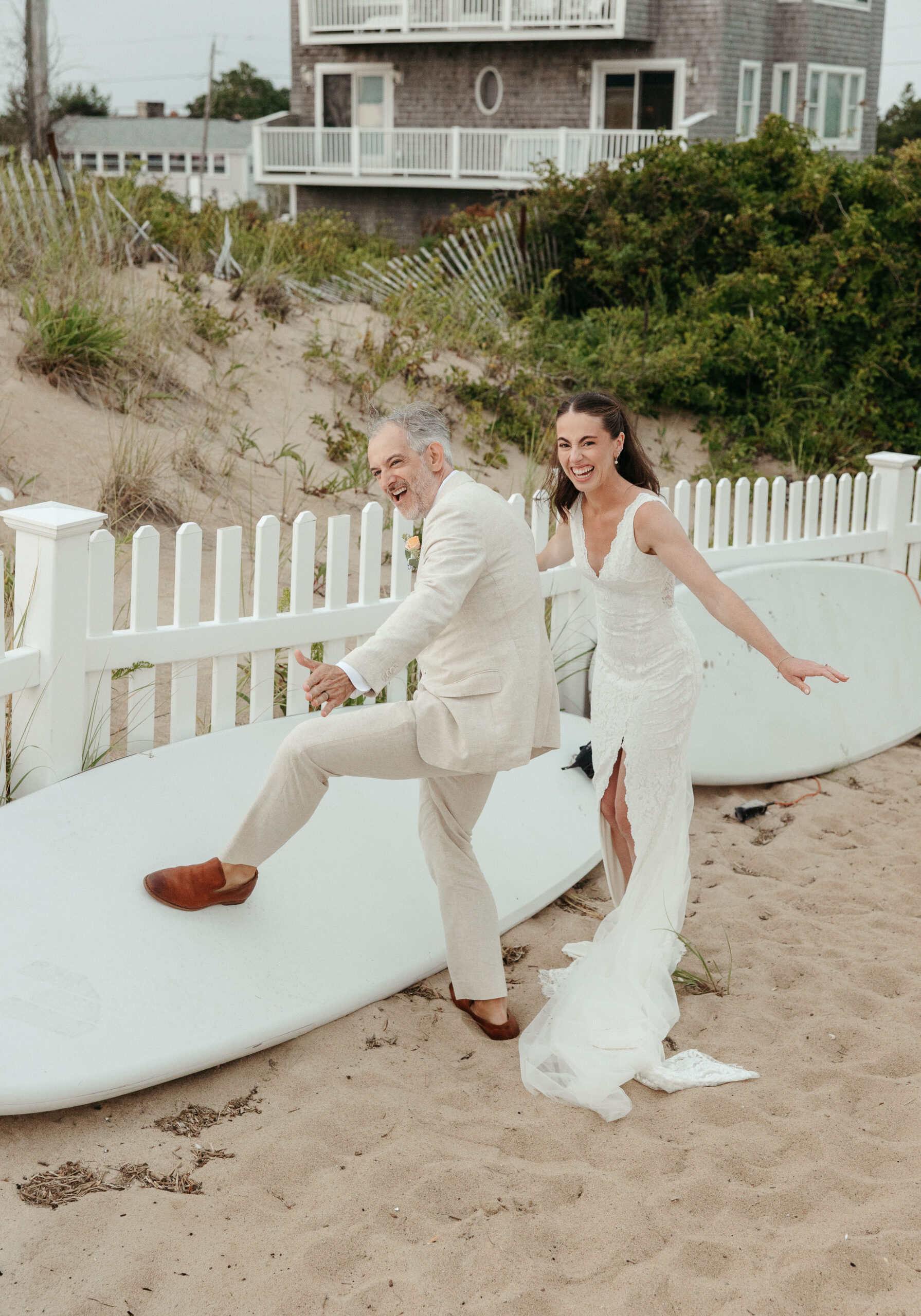 couple enjoys candid moment at their intimate coastal wedding in Newburyport, MA